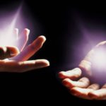 Hands with light emminating from them